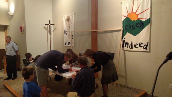 Friends write notes in memory of Denver Wolf, a 16-year-old girl killed by her father