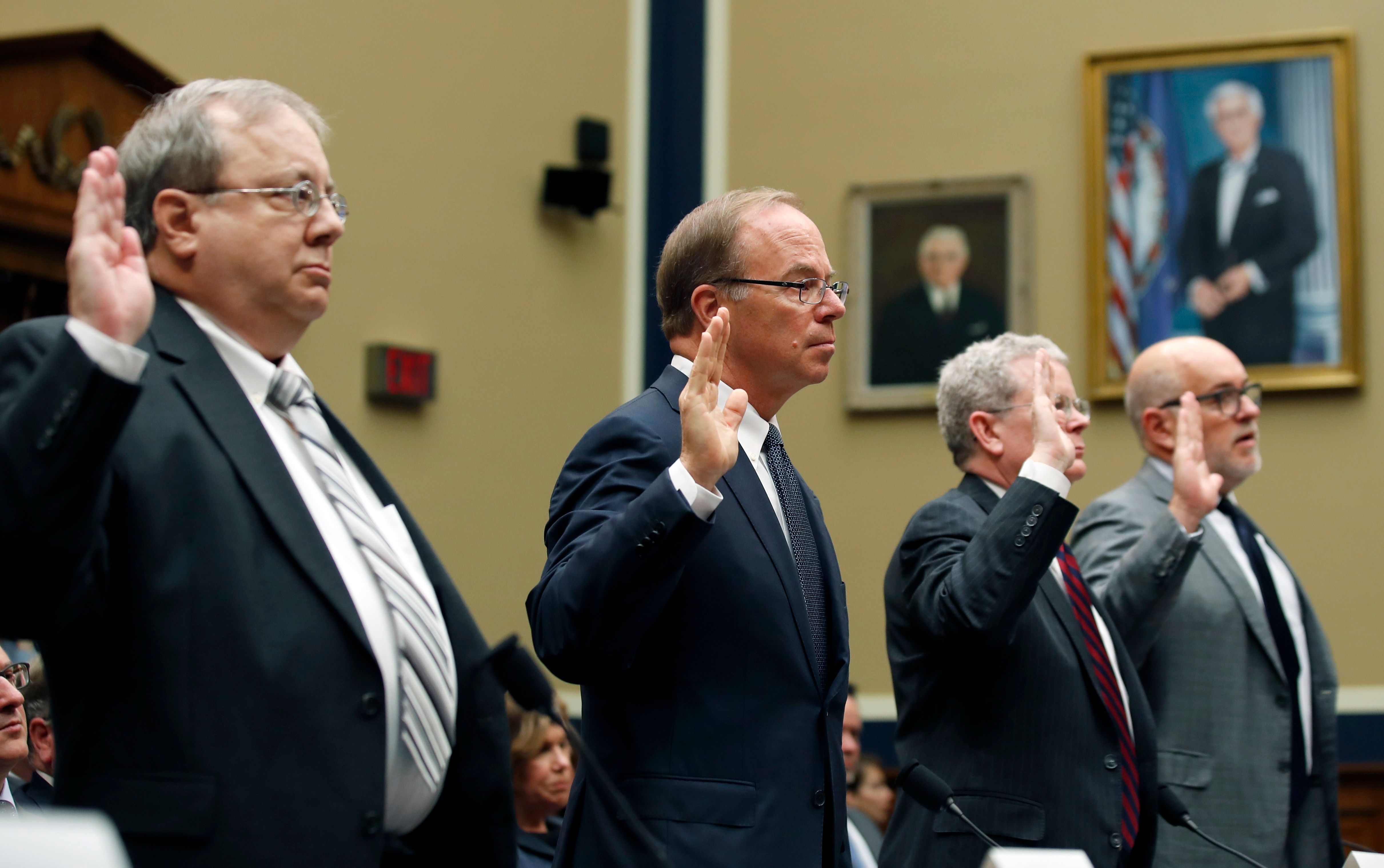 Drug company executives are sworn in before they testify during a hearing of the Committee on Energy and Commerce, Subcommittee on Oversight and Investigations, about the opioid epidemic, on Capitol Hill, Tuesday, May 8, 2018 in Washington.
